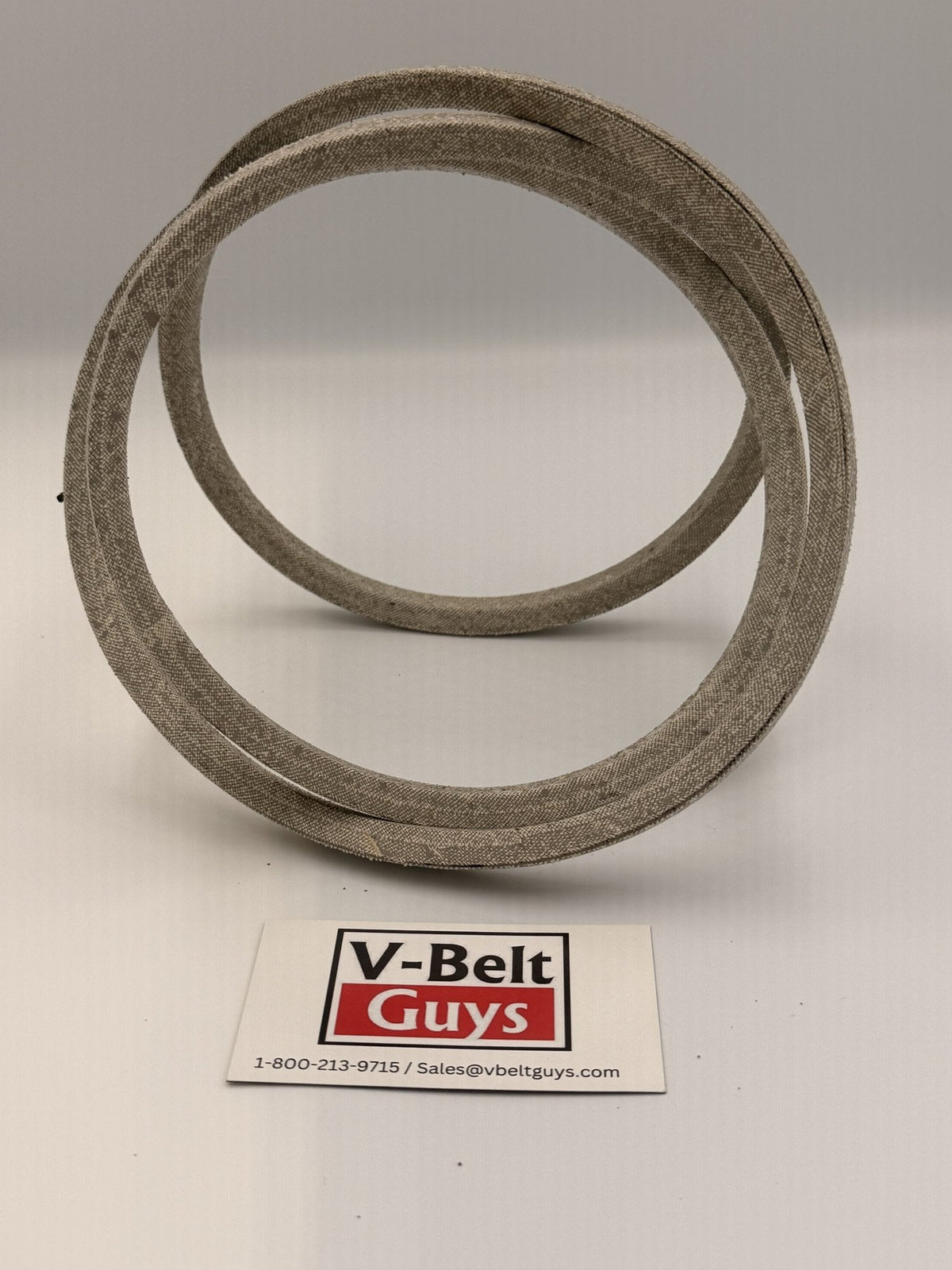 Aramid wrapped V-belt standing upright with V-Belt Guys card